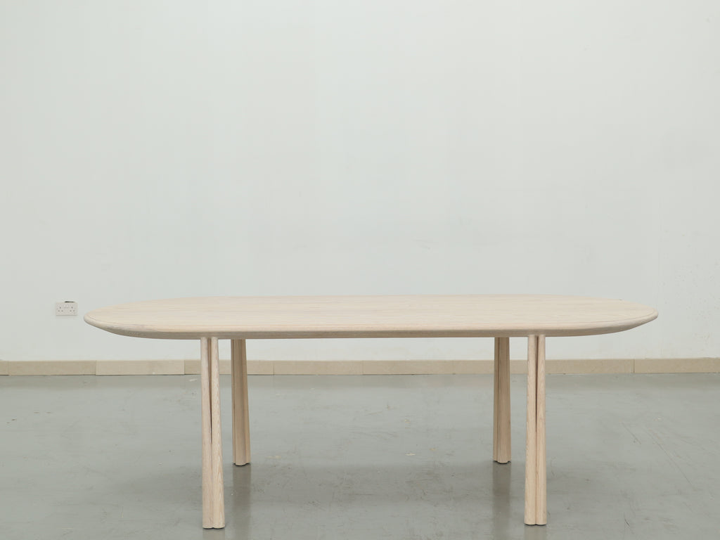 Soleil Oval Dining Table Indoor Front Perspective View 1