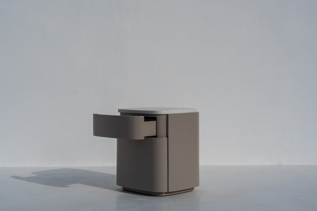 Arca rounded bedside table with a drawer open