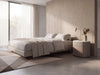 Arca rounded bedside table in a minimalist bedroom with soft neutral tones