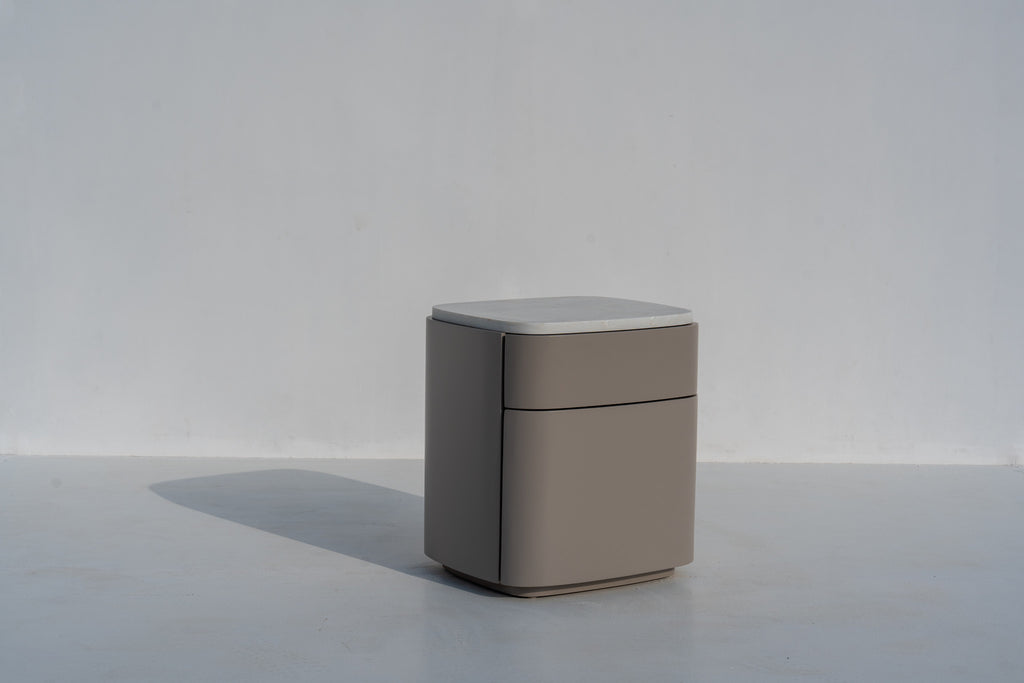 Arca modern nightstand in taupe with stone top, side view showing the rounded corners
