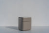 Arca bedside table with drawers in taupe lacquer and engineered stone top, three-quarter view