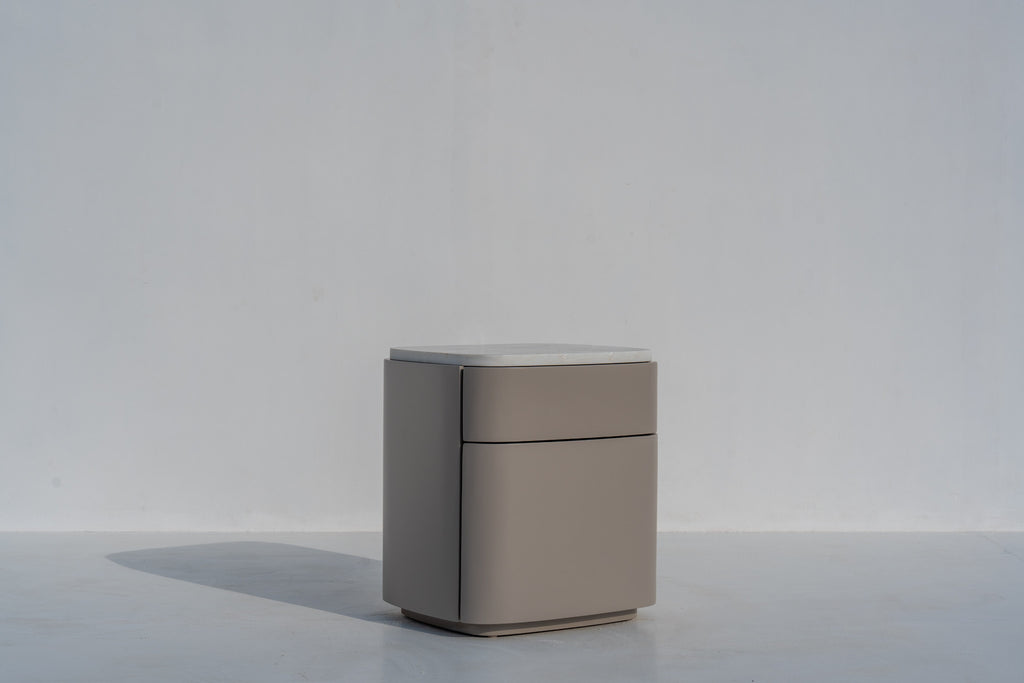 Arca bedside table with drawers in taupe lacquer and engineered stone top, three-quarter view