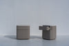 Pair of Arca rounded bedside tables, one with a drawer open