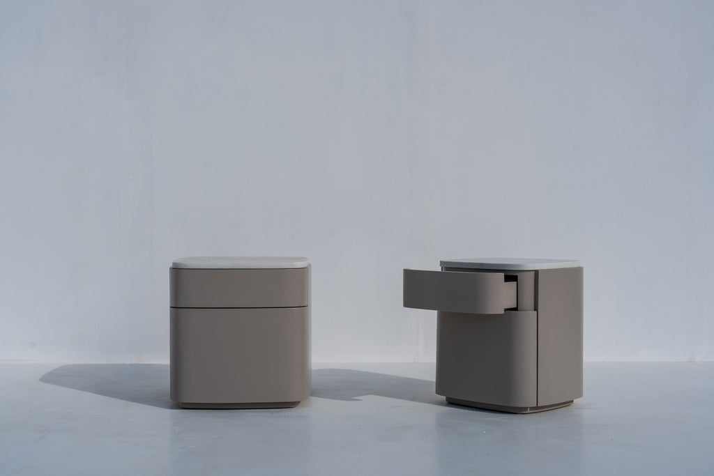 Pair of Arca rounded bedside tables, one with a drawer open