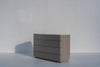 Arca four-drawer chest of drawers with curved wraparound fronts and engineered stone top