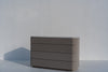 Minimalist Arca taupe chest of drawers with handle-free drawers and stone top