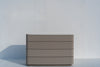 Arca taupe four-drawer chest with white stone top, three-quarter view