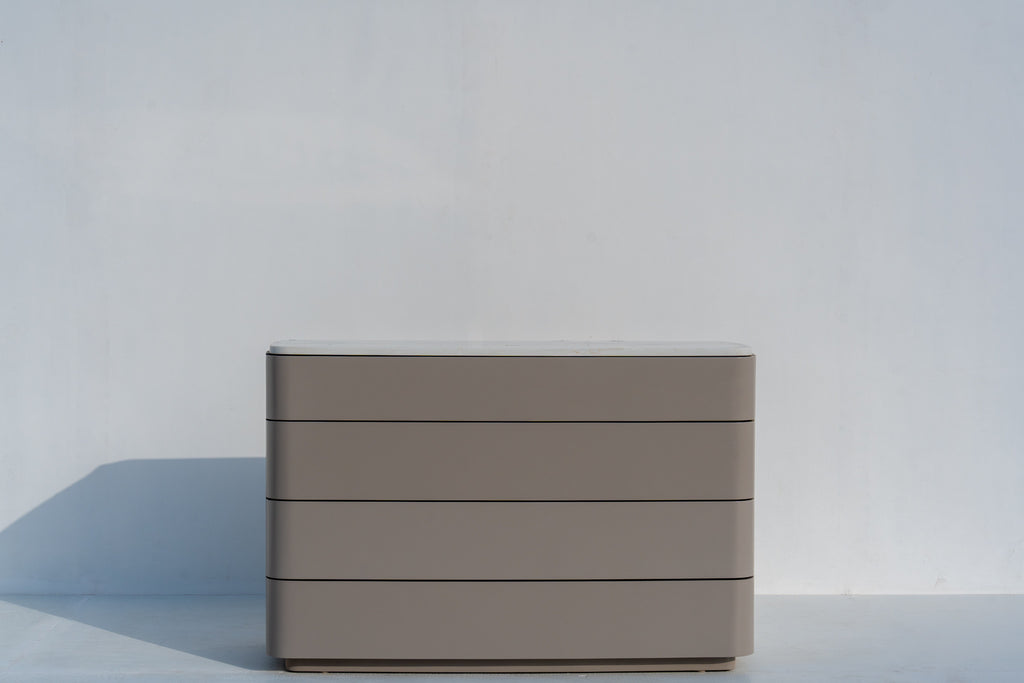 Arca taupe four-drawer chest with white stone top, three-quarter view