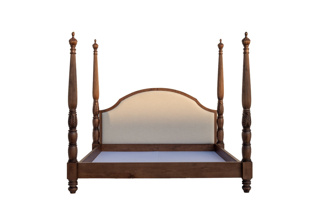 Williamsburg carved four poster bed front view on white, reeded posts and arched ivory linen headboard