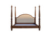 Solid wood four poster bed with camelback linen headboard and urn finials, front view on white