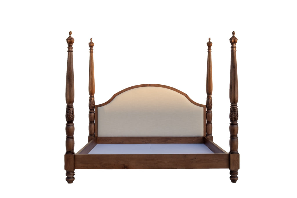 Super king four poster bed in walnut finish with acanthus-carved posts, straight-on view on white