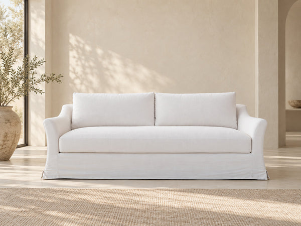 Belmont white Belgian linen slipcovered sofa in a neutral Dubai living room, front view