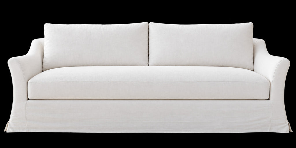 Belmont slipcovered sofa front view showing bench seat, two back cushions and kick-pleat skirt