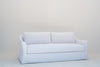 Belmont linen slipcovered sofa, angled view showing the flared slope arm