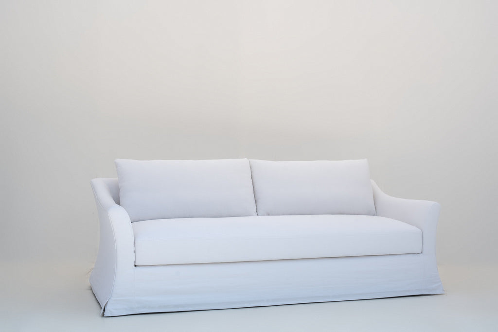 Belmont linen slipcovered sofa, angled view showing the flared slope arm
