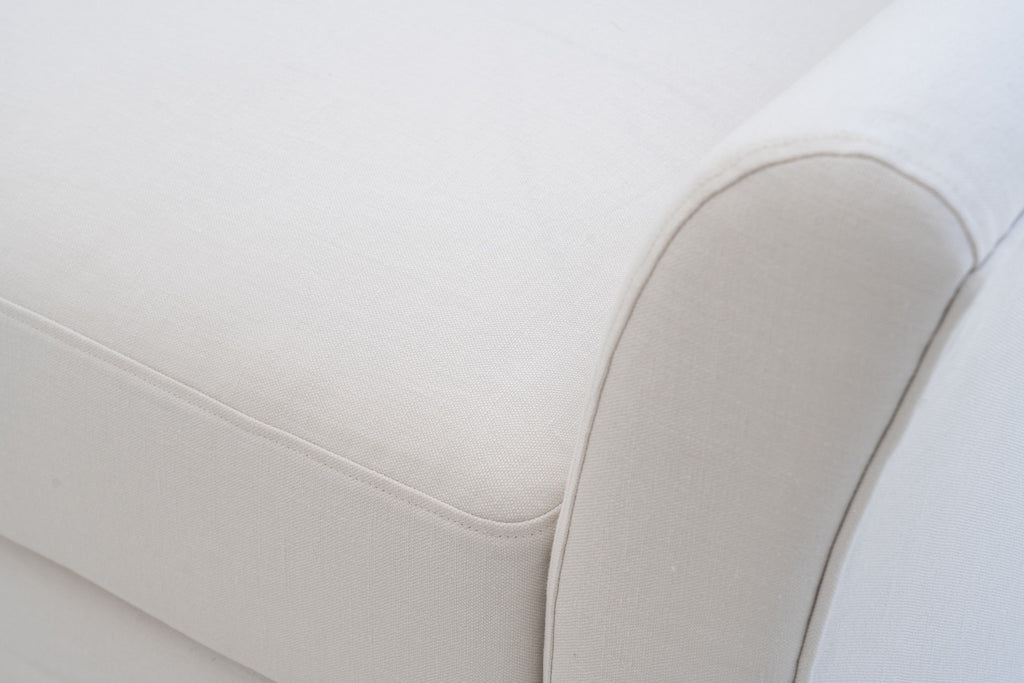 Close-up of the Belmont slope arm with self piping in Belgian linen