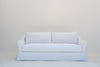 Belmont linen sofa front elevation with tailored skirt and corner kick pleats