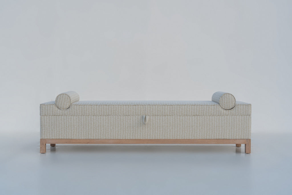 Carmel bolster storage bench front view, sand print upholstery on a solid oak base, made in Dubai