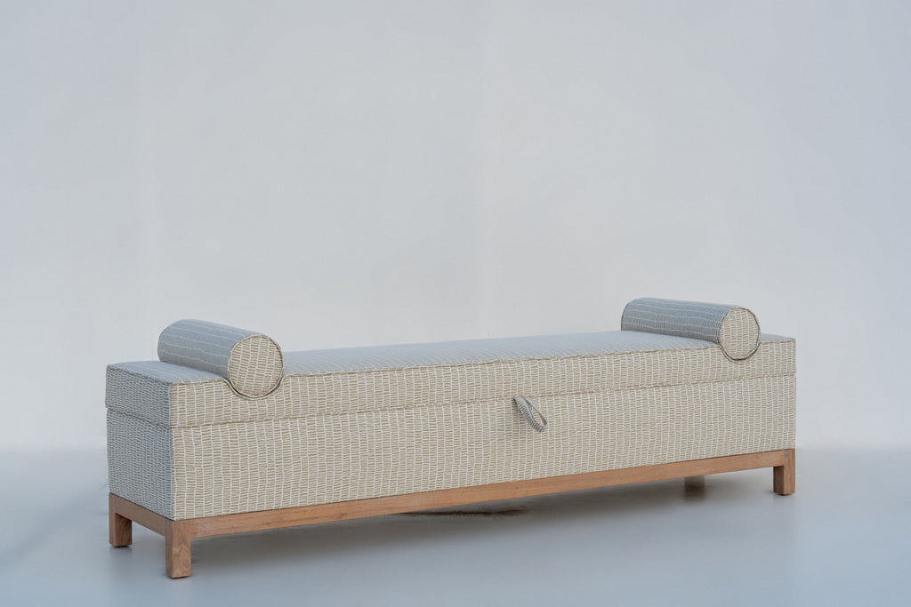 Oak storage bench with upholstered lift-up seat, fabric pull tab and two bolsters