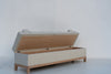 Carmel storage bench with lid open showing the oak-lined storage compartment