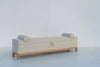 Carmel storage bench angled view showing solid oak plinth base and square legs