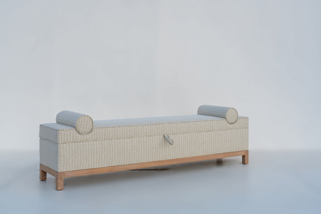Carmel storage bench angled view showing solid oak plinth base and square legs