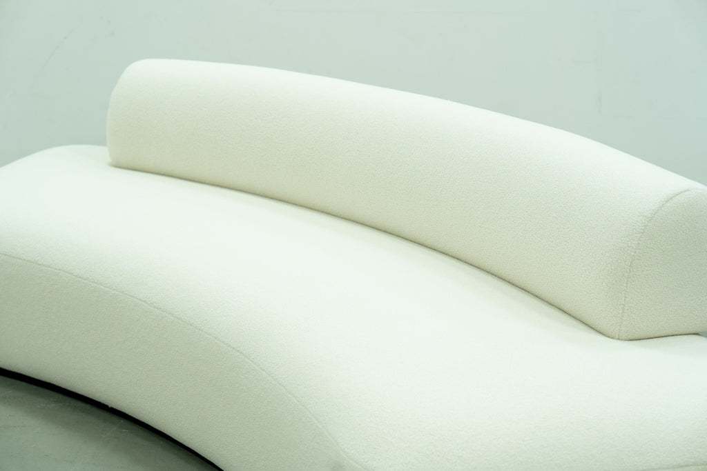 Close-up of the Dune curved bolster backrest and bouclé seat