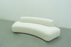Curved sofa in Dubai, the Dune in white bouclé, angled view from above
