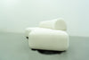 End view of the Dune curved sofa with rounded seat edges and bolster profile