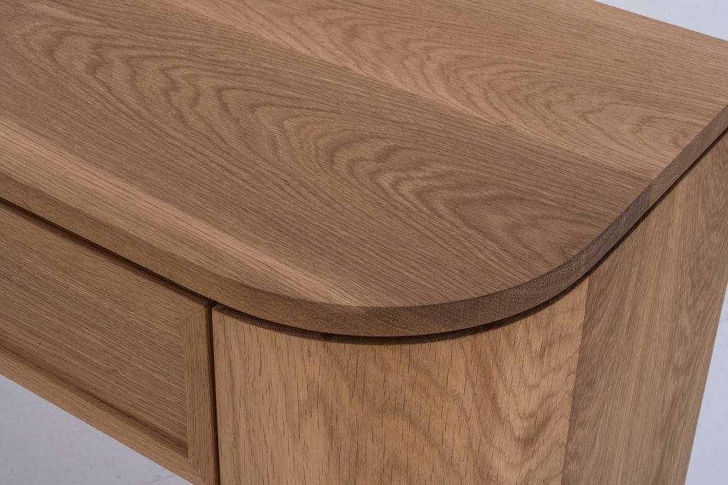 Solid oak console table with softly rounded corners and natural oak finish