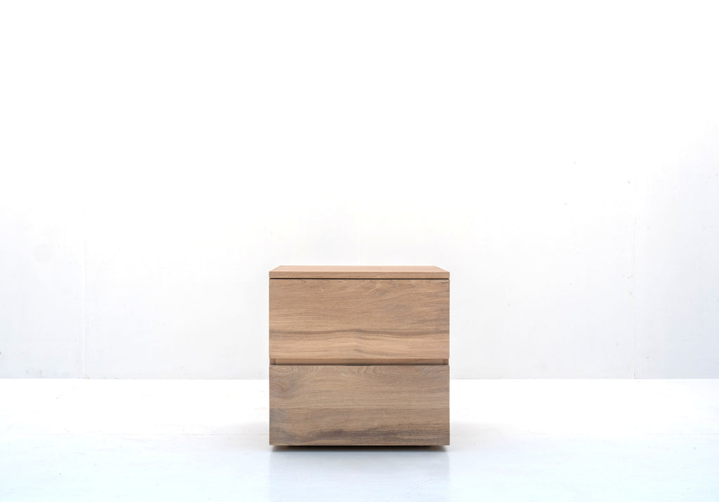 Minimalist natural oak bedside table with two handle-free drawers