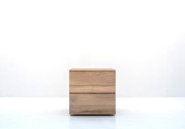Minimalist natural oak bedside table with two handle-free drawers