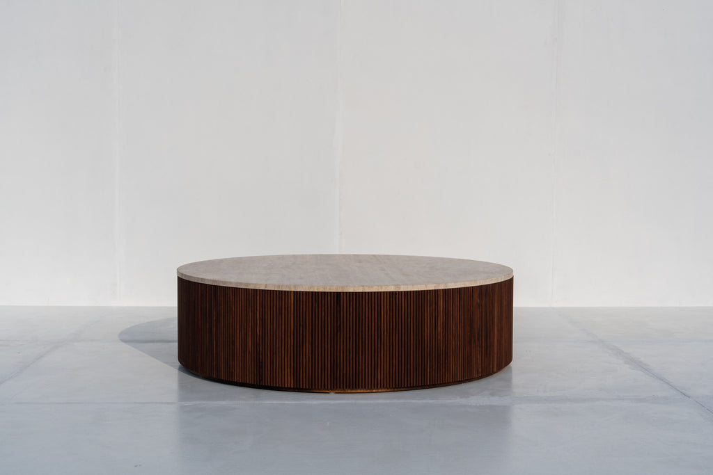 Milo round travertine coffee table with fluted walnut base in Dubai