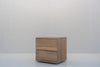 Minimalist natural oak bedside table with two handle-free drawers