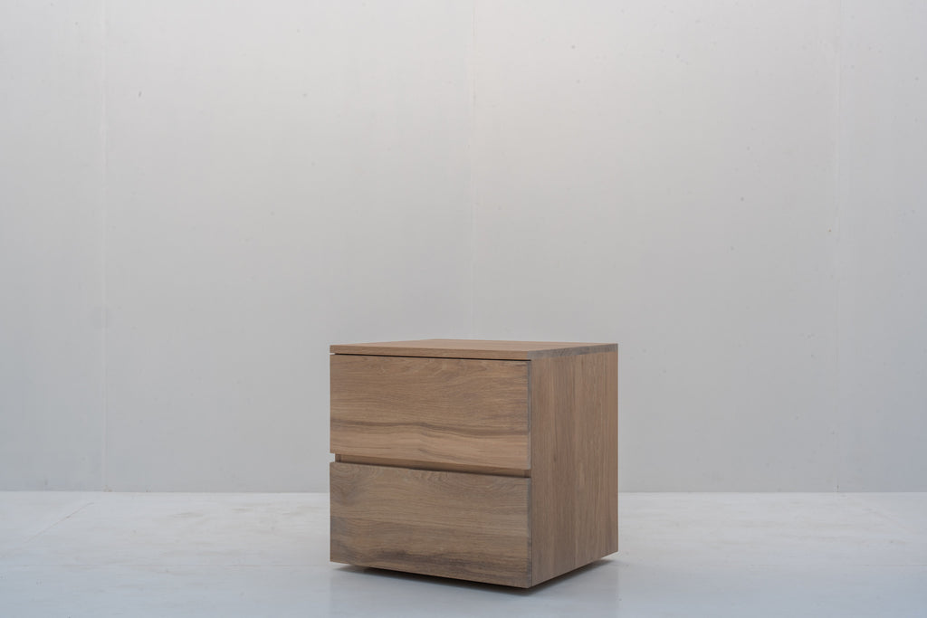 Minimalist natural oak bedside table with two handle-free drawers