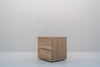 Minimalist natural oak bedside table with two handle-free drawers