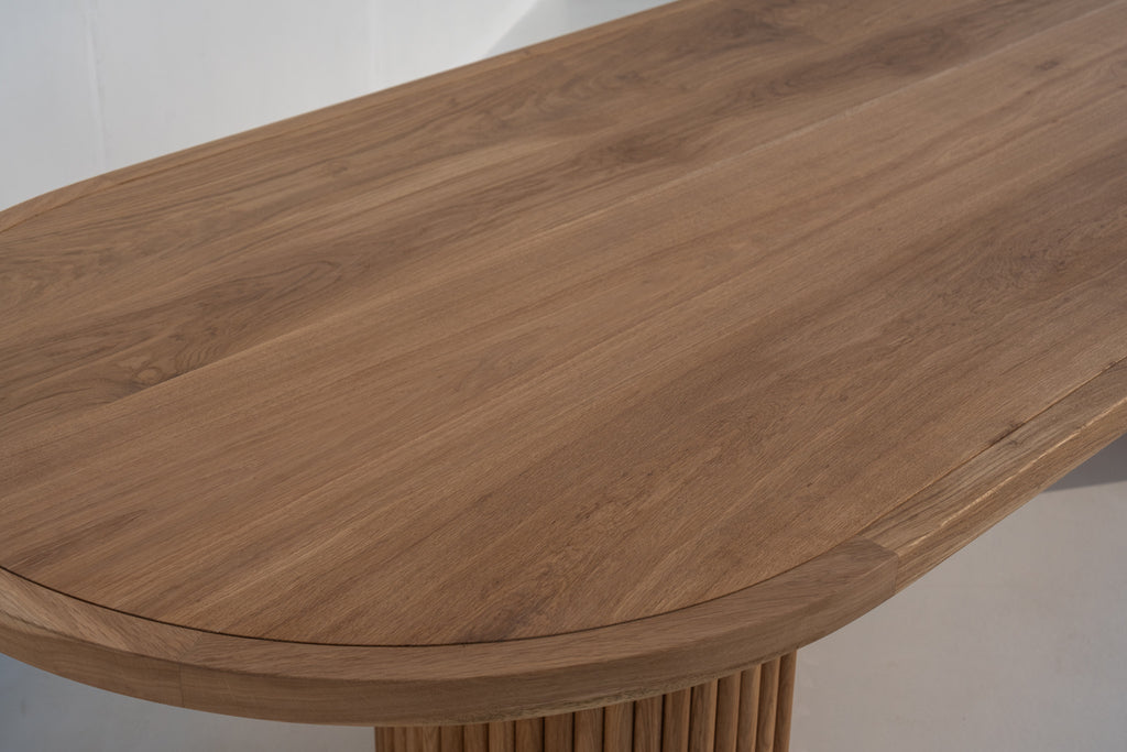 Calder solid oak oval dining table with fluted pedestal legs in Dubai