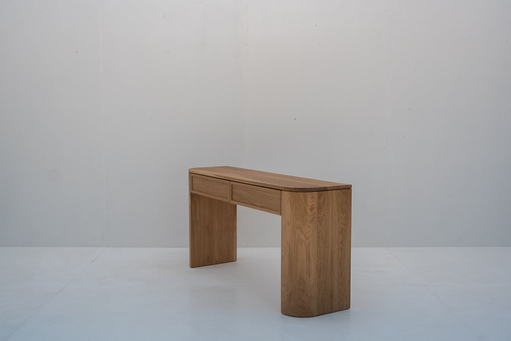 Solid oak console table with softly rounded corners and natural oak finish