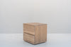 Minimalist natural oak bedside table with two handle-free drawers