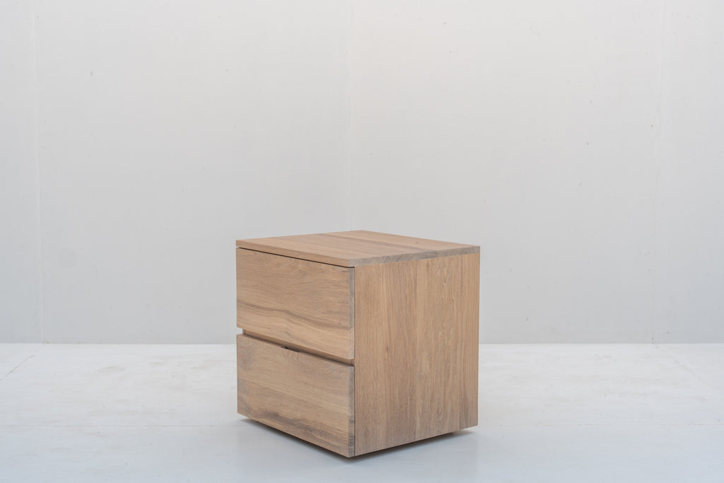 Minimalist natural oak bedside table with two handle-free drawers