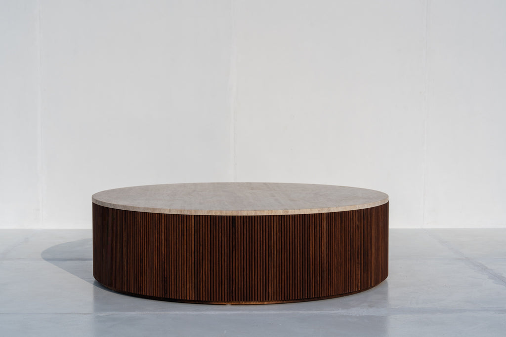 Milo round travertine coffee table with fluted walnut base in Dubai