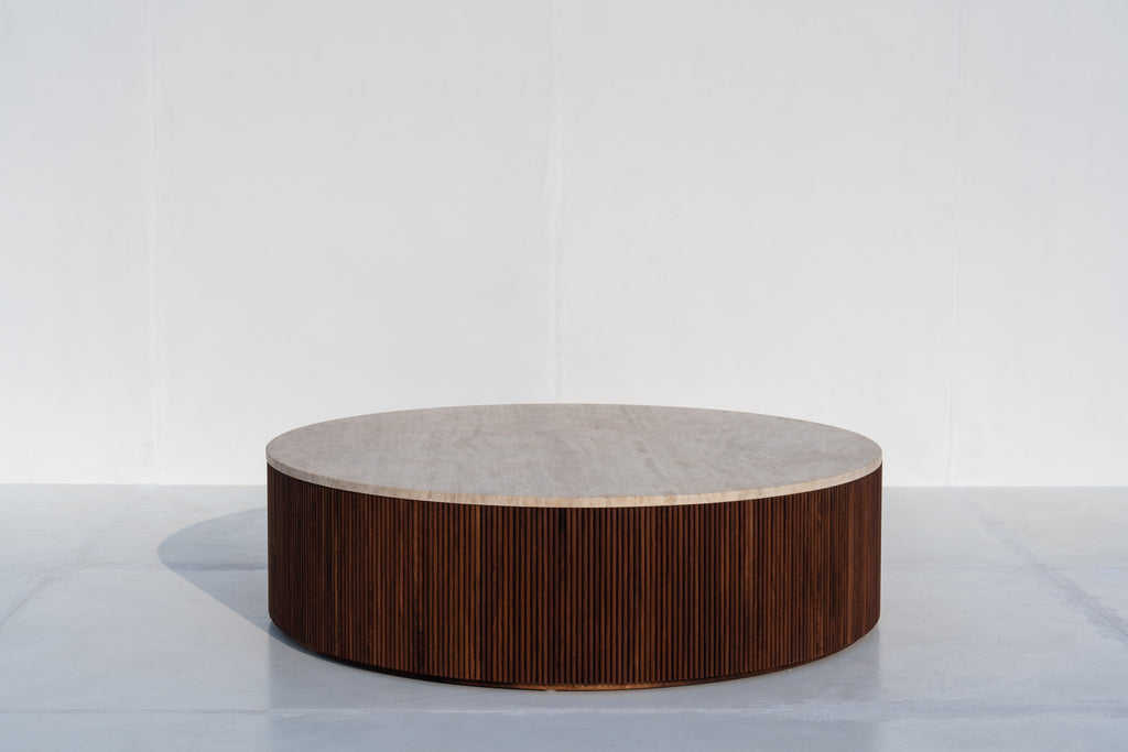 Milo round travertine coffee table with fluted walnut base in Dubai