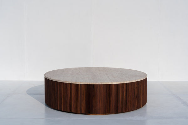 Milo round travertine coffee table with fluted walnut base in Dubai