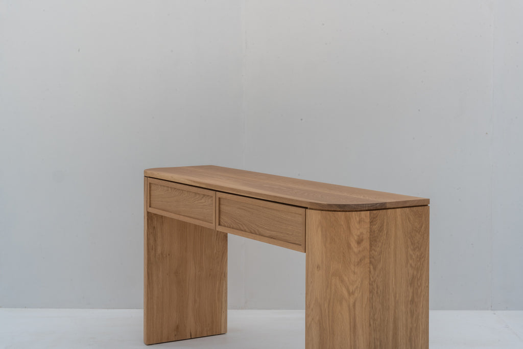 Solid oak console table with softly rounded corners and natural oak finish