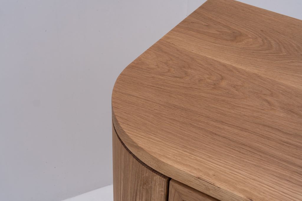 Solid oak console table with softly rounded corners and natural oak finish