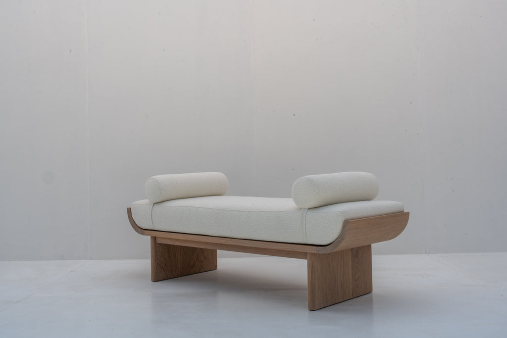 Side profile of solid oak bouclé upholstered bedroom bench