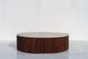 Milo round travertine coffee table with fluted walnut base in Dubai