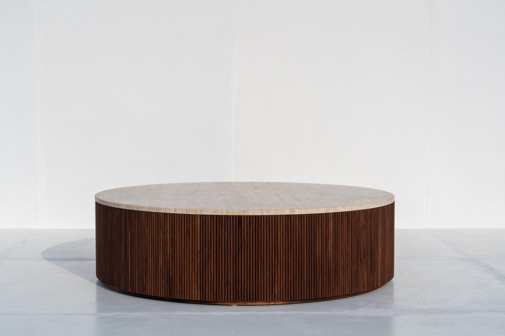 Milo round travertine coffee table with fluted walnut base in Dubai