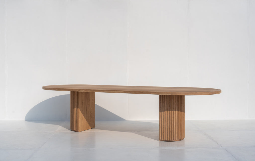 Calder solid oak oval dining table with fluted pedestal legs in Dubai