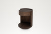 Round oak bedside table, angled view of the open shelf and recessed plinth base